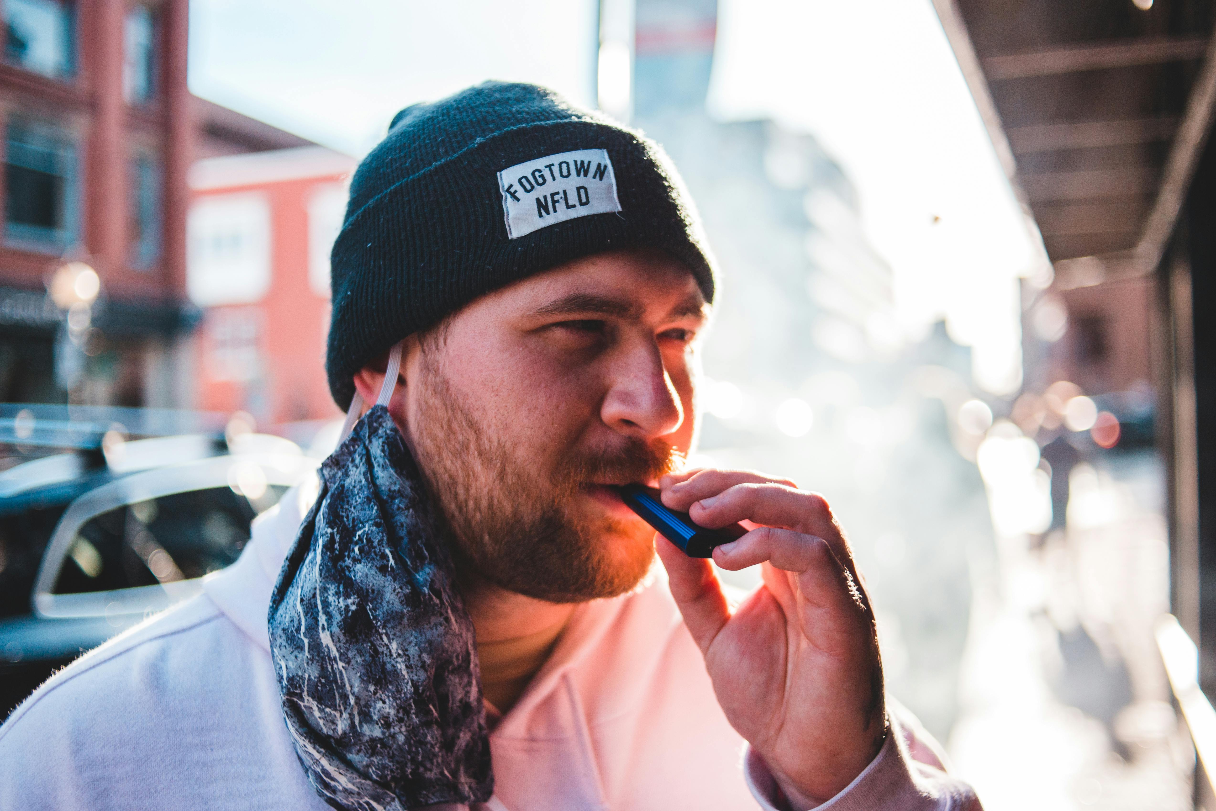 bearded man enjoying a disposable vape